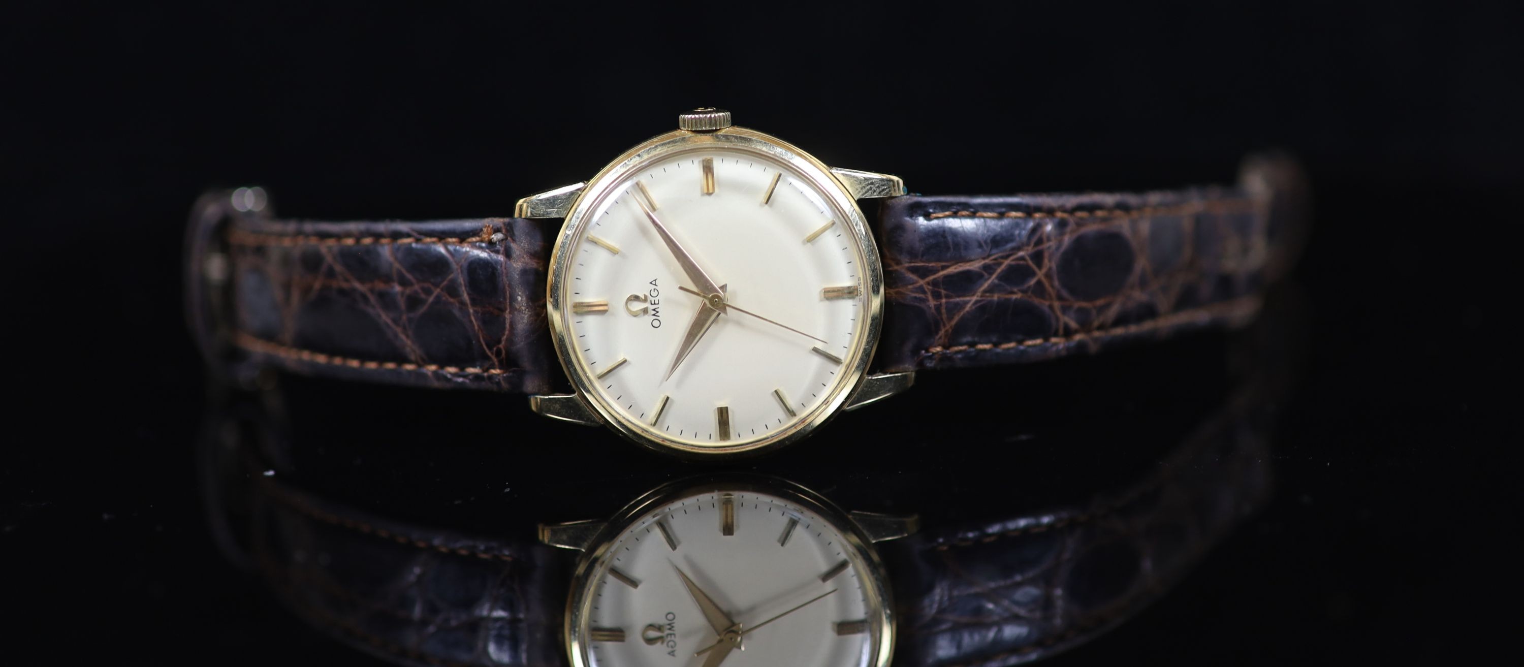 A gentleman's late 1950's 14ct gold Omega manual wind wrist watch